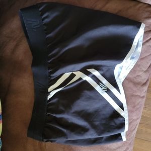 Varsity spirit lined cheer shorts,   size medium, black and white
